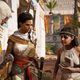 A screenshot from the game shows two women asking two Egyptian warriors for help.